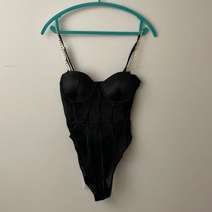 Gold Chain and Black Bodysuit